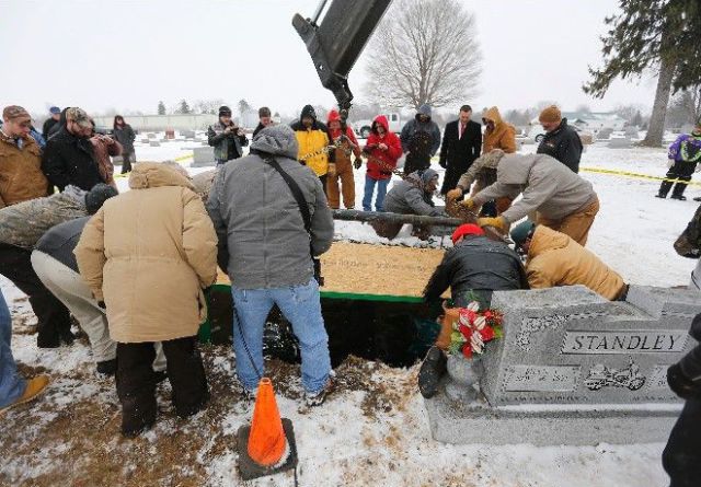 Biker Buried Riding His Harley Davidson