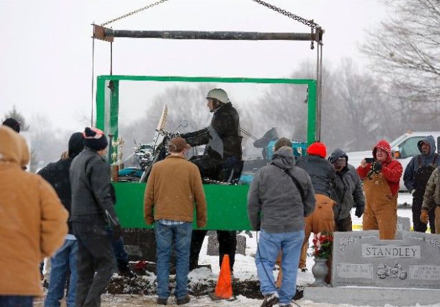 Biker Buried Riding His Harley Davidson