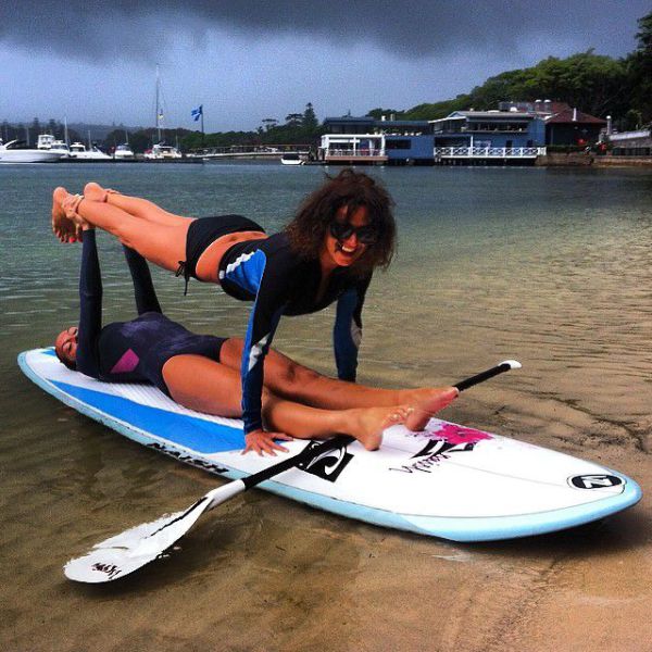 Surfboard Yoga Is a Fun New Form of Beach Exercise