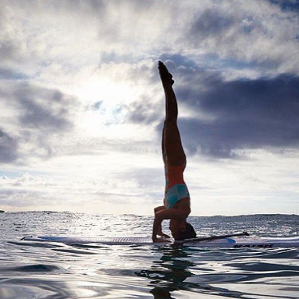 Surfboard Yoga Is a Fun New Form of Beach Exercise