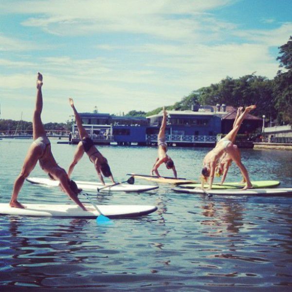 Surfboard Yoga Is a Fun New Form of Beach Exercise