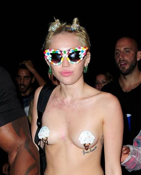 Miley Cyrus Parties Topless in Town